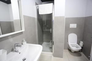 a bathroom with a sink and a toilet at New Ulivo Apartment 2 in Seriate