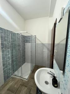 a bathroom with a shower and a sink at Casa Giuli in Villasimius