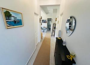 a hallway of a home with a mirror at Alexias Home in Tsagarada