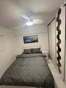 a bedroom with a bed and a ceiling fan at Luxuery View in Calpe +16 photos
