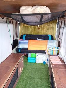 an interior view of the inside of a camper with a bed and a table at Vintage Camper Van Explore Driving Mallorca - full equip in Palma de Mallorca