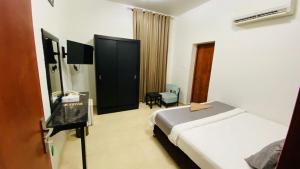 Ліжко або ліжка в номері Almultaqa Hotel فندق الملتقى