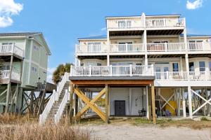 a large house on the beach with two condos at 1322 New River Inlet Road- Oceanfront, 240 EV outlet, Elevator, Sleeps 18, Hot tub in North Topsail Beach +55 photos