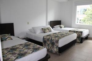 Postel nebo postele na pokoji v ubytování Hotel Mediterraneo
