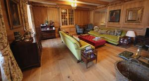 a large living room with a couch and chairs at Mingary Castle - Restaurant with Rooms in Kilchoan