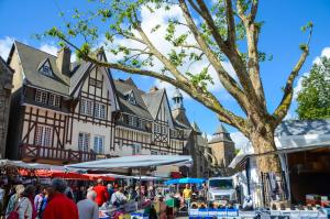 an open air market in front of an old building at Auberge de Jeunesse HI Saint-Brieuc in Saint-Brieuc