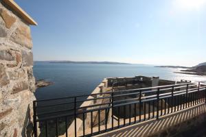 a view of a body of water from a building at Mingary Castle - Restaurant with Rooms in Kilchoan
