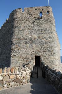 a large brick wall with a door in it at Mingary Castle - Restaurant with Rooms in Kilchoan