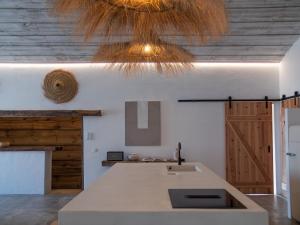 a kitchen with a sink and a ceiling at Casa Thala - Conceptual 3-Suite Villa & Hot Pool in Alcácer do Sal +68 photos