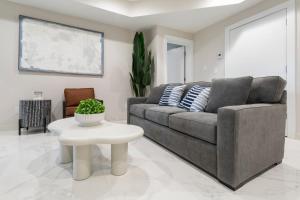 a living room with a couch and a table at Ammos Luxury Living- Crete Suite in Ventnor City