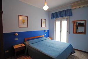 Postel nebo postele na pokoji v ubytování Residence Settebello