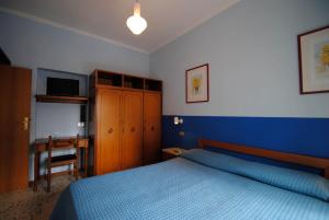 Postel nebo postele na pokoji v ubytování Residence Settebello