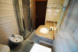 Koupelna v ubytování Residence Settebello + 8 fotografií