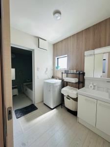 Koupelna v ubytování 福の荘 空港2号棟