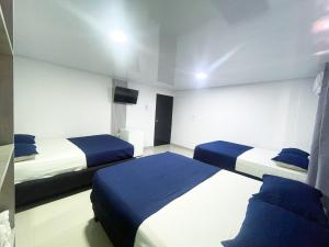 Postel nebo postele na pokoji v ubytování Bless Hotel