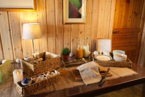 a table with baskets and other items on it at Comfortable B&B near Senja in Brostadbotn +21 photos