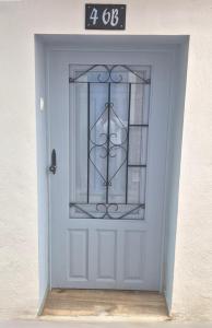 a blue door with a sign on top of it at Viura - Harbor's Light in Villajoyosa
