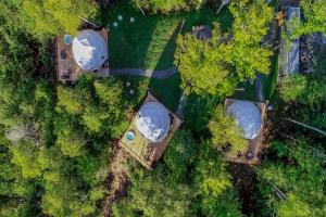 an overhead view of a park with trees and buildings at Bel Air Tremblant Hotel - Dômes & Chalets in Mont-Tremblant
