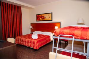 Letto o letti in una camera di Gullo Hotel