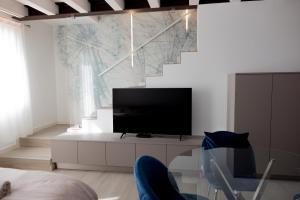 Un televizor și/sau centru de divertisment la Apartment-Boutique Stella