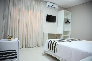 Postel nebo postele na pokoji v ubytování Ventura Hotel