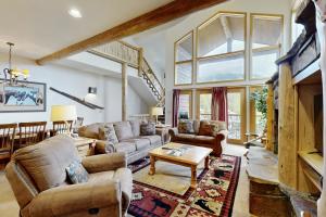 a living room with a couch and a table at Ski Slopes and Scenic Views in Whitefish