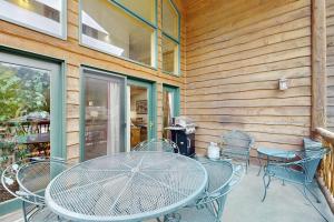 a table and chairs sitting on a patio at Ski Slopes and Scenic Views in Whitefish