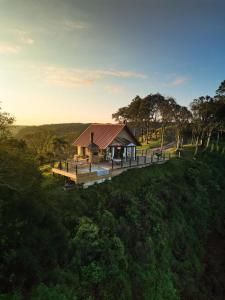an aerial view of a house in a field at Morada Valente in Gramado