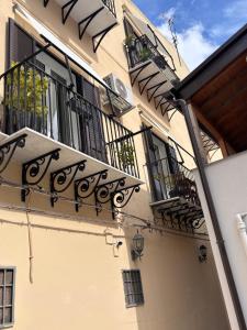 a building with balconies on the side of it at Olivuzza 27 in Palermo