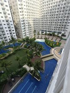 an aerial view of a resort with palm trees and buildings at Shore residences tower D in Manila