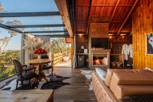 a living room with a couch and a fireplace at Morada Valente in Gramado