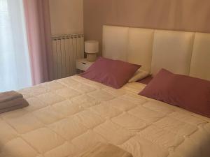 Łóżko lub łóżka w pokoju w obiekcie Bed & Breakfast con vista giardino e piscina