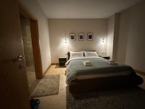 Postel nebo postele na pokoji v ubytování Hotel Epidami