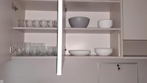 Η κουζίνα ή μικρή κουζίνα στο White Harmony Apartment