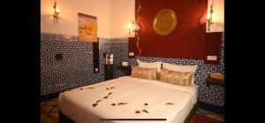 Postel nebo postele na pokoji v ubytování Riad Nouceiba Marrakech