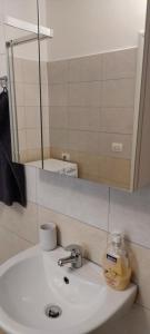 Koupelna v ubytování Vigga Apartment + 14 fotografií