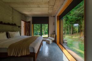 Giường trong phòng chung tại Veranda 4M