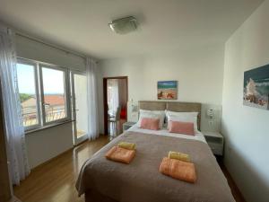 Postel nebo postele na pokoji v ubytování Apartmani Braut + 37 fotografií