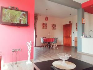 Televisyen dan/atau pusat hiburan di Red Apartamento