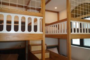two bunk beds in a dorm room at Vibe Home Vinhomes Ocean Park 2 in Hòa Bình