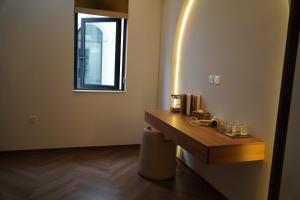 a bathroom with a wooden counter and a window at Vibe Home Vinhomes Ocean Park 2 in Hòa Bình