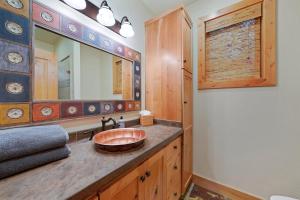 a bathroom with a sink and a mirror at Vivian Park House in Vivian Park +21 photos