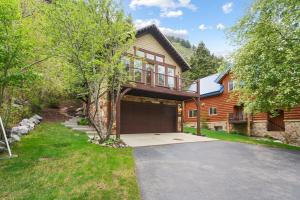 a wooden house with a garage and a driveway at Vivian Park House in Vivian Park