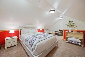a bedroom with a large bed and red walls at Vivian Park House in Vivian Park