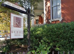 a sign for an historic inn in front of a house at Kehoe House, Historic Inns of Savannah Collection in Savannah