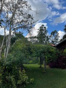 a park with a bench in the middle of a yard at Chale Nha Chica in Alagoa