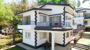 an image of a house with a balcony at Space Villa, Esperanza by Svar Stays with Breakfast, Swimming View and Valley View in Panchgani