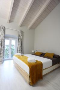 Postel nebo postele na pokoji v ubytování New Ulivo Apartment 4