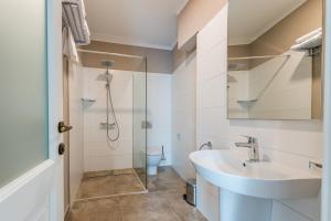 a bathroom with a sink and a shower at Casa Petra in Sibiu +50 photos