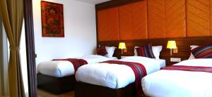 Postel nebo postele na pokoji v ubytování Hotel Sherpani